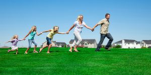 Family running on grass